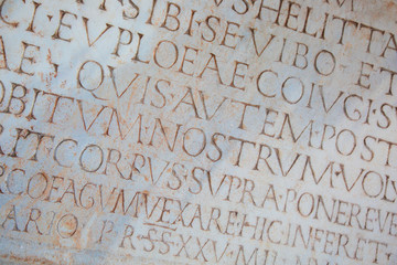 Ancient words in latin carved on stone, Pisa