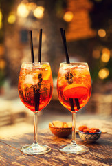 Two glasses of Aperol Spritz cocktails on the table in restaurant, Taormina, Sicily, Italy. - 202234181