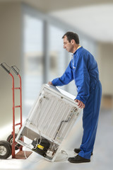 Delivery man pushing hand truck washing machine home appliance