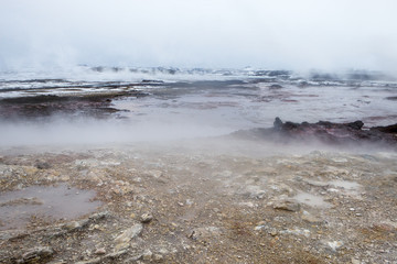 Steam rising from the ground at the hot spring