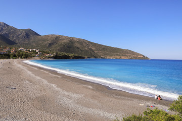Fototapeta na wymiar Beautiful beach of the greek village Kiparissi Lakonia, Peloponnese during summer holidays.