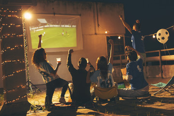 Friends watching a football match