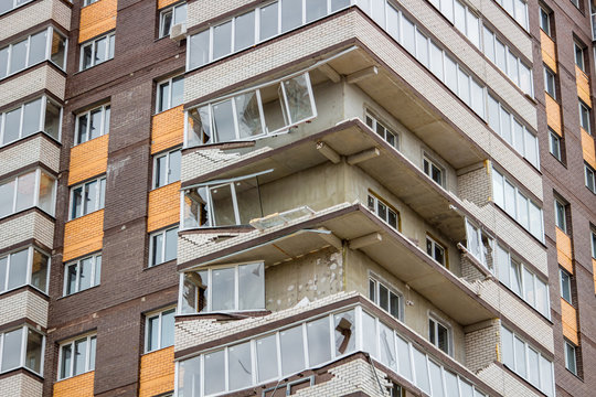 Obninsk, Russia - April 22, 2018: Damage to loggias on a 20-storey house as a result of a strong hurricane wind. Workers dismantle damaged structures