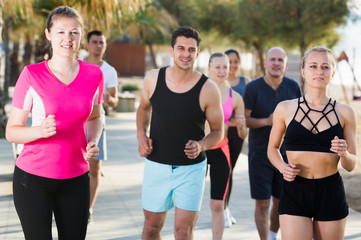 People running along embankment