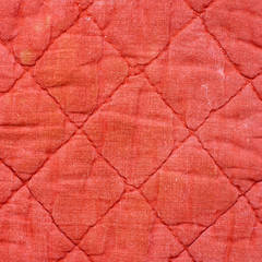 texture of red quilted fabric