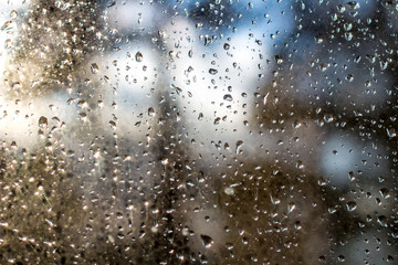 Rain drops on the glass in the sunlight
