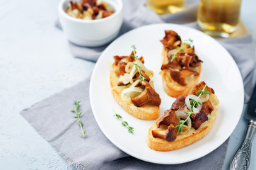 Fried chantarelle onion toasts