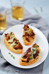 Fried chantarelle onion toasts