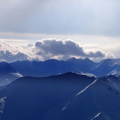 Silhouette of evening mountains in mist