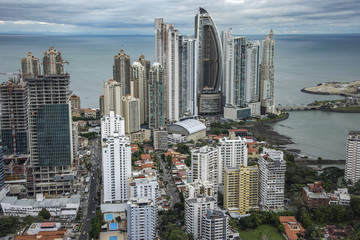The beautiful and modern skyline of tall city buildings of Downtown Panama under a blue sky