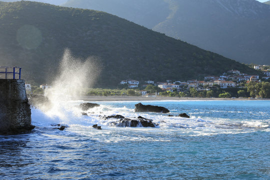 Wave hit the rocks near to the greek village Kiparissi Lakonia, Peloponnese during summer holidays.