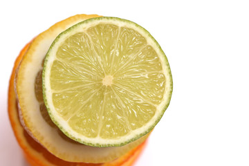 Pyramid of citrus fruits, lemon, lime and orange. View from above