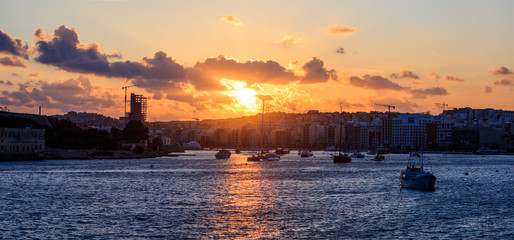 Fototapeta na wymiar Malta Valletta. Modern area Sliema at sunset