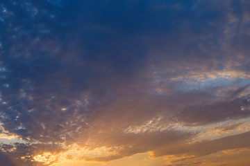 Naklejka na ściany i meble Colorful sky with clouds. Sunset background.