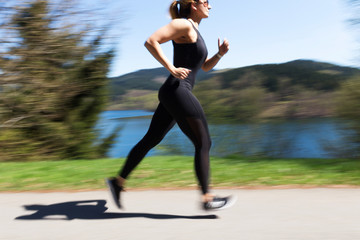 female runner in action in spring