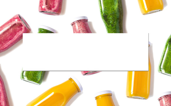 Colorful smoothies in bottles  with blank isolated sheet for your text or design. Natural Organic Food Style.