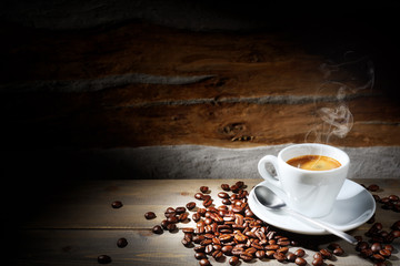 Espresso coffee on wood background with space for text