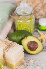 Obraz na płótnie Canvas Natural cosmetic oil and natural handmade soap with avocado