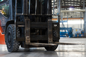 Fototapeta na wymiar Working Forklift in warehouse. Forklift loader pallet stacker truck equipment at warehouse