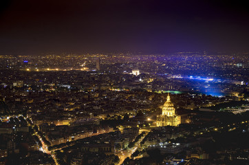 Fototapeta na wymiar Aerial view of Paris city of light with veiw of Domes Les Invalides and Arc de Triumph, at evening. View from Montparnasse highest skyscraper in France