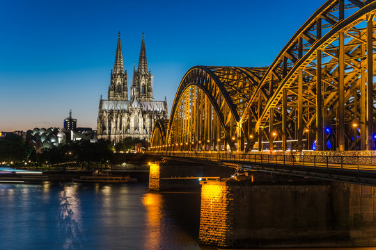 Cologne Cathedral and Hohenzollern Bridge at nighttime