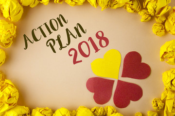 Conceptual hand writing showing Action Plan 2018. Business photo showcasing to do list in new year New year resolution goals Targets written on plain background within Paper Balls Hearts.