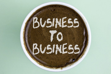 Writing note showing  Business To Business. Business photo showcasing Working ground businessman busy work hard stop playing written on Coffee in a Cup on the plain background.