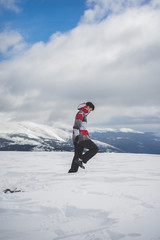 Fototapeta na wymiar Young boy exploring the snowy landscape