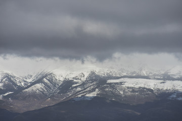 Fototapeta na wymiar Snowy landscape with huge mountains