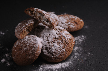 oatmeal cookies on a black table in castor sugar