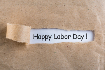 International labor Day at May 1st. Day text on notes in torn envelope. Spring time, labour day - 1...
