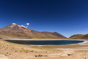 miniques volcano and lagoon at andes mountain range