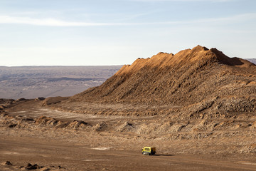 mountain next to the road with truck in the moon valley in the atacama desert