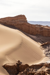Fototapeta na wymiar sedimentary rocks in the dunes of the moon valley in the atacama desert