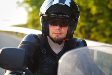 rider on a motorcycle - summer road trip on a motorbike