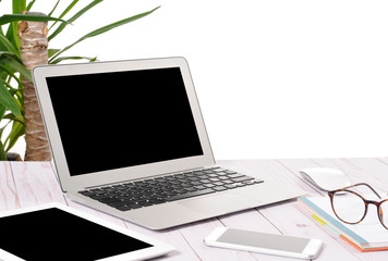 Computer laptop, tablet and phone on wooden desk