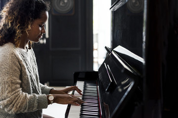 Woman playing on a piano