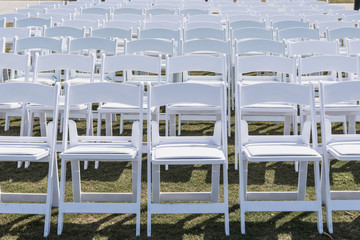 White Chairs Set Up for Wedding