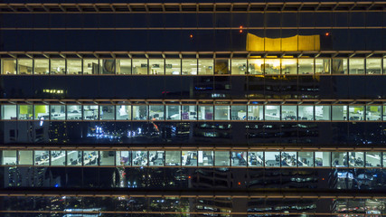 View of office building windows at night