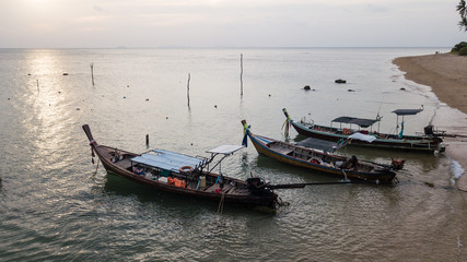 Fishing boat parked on the sea shore