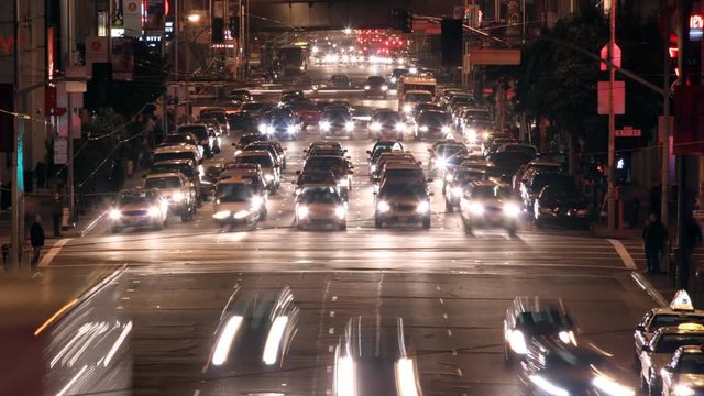 Time-lapse overhead night view of oncoming traffic on Howard Street in San Francisco