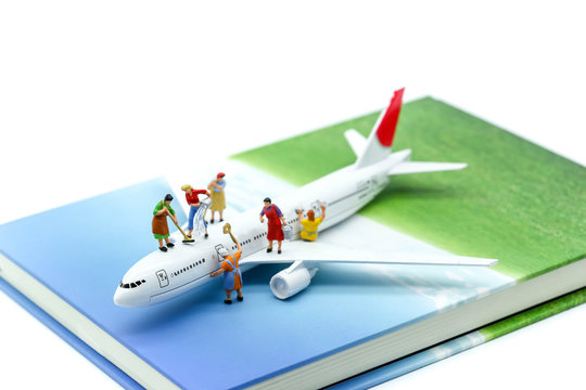 Miniature people : Maid or Housewife cleaning on  air plane using for business trip concept.