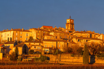 Fototapeta premium Sablet medieval village in sunset light, Provence, France