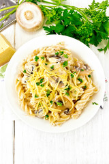 Fusilli with mushrooms on board top