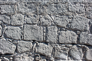 Hintergrund – Natursteinmauer mit eckigen Steinen