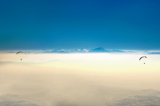 Paragliding Over Fog Covered Mountain Peaks, Paraglider Pov