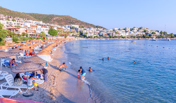 Typical Aegean architecture houses with white color and beach