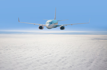 White passenger airplane in the clouds. travel by air transport