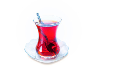 Glass of Turkish tea isolated on white background