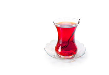 Glass of Turkish tea isolated on white background